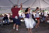 Kaleinani Ohumukini dances with some of the spectators - White Springs, Florida.