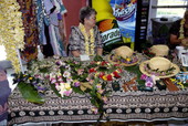 Woman selling leis and hatbands - Celebration, Florida.