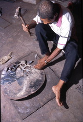 Almann Ulysee works on metal - Miami, Florida.