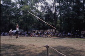 Herman and Louise Ibock perform a caber toss at the Florida Folklife Festival - White Springs, Florida.