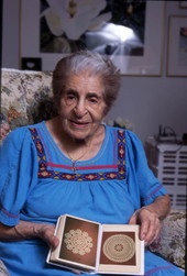 Lillian Shoucair shows pictures of her tatting projects - Titusville, Florida.