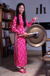 Tina Nguyen, Vietnamese musician with a gong - Orlando, Florida.