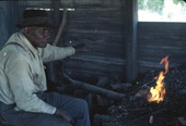 Blacksmith Thomas Rains tending to his fire - Monticello, Florida