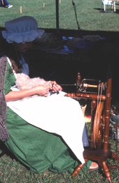 Costumed interpreter sewing at Pioneer Days - Orlando, Florida.