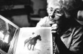 Maggie Melton showing her photo album- Plant City, Florida