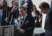 Governor Reubin Askew speaking at the Stephen Foster Day celebration as Secretary of State Bruce Smathers (R) listens- Tallahassee, Florida.