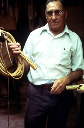 Claude Sheppard standing with whips he made - Gainesville, Florida.