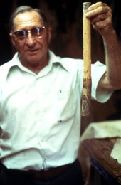 Claude Sheppard holding the handle of a whip - Gainesville, Florida.