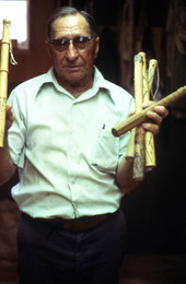 Claude Sheppard holding the handles of whips - Gainesville, Florida.