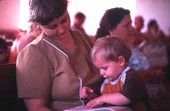 Mother and son with a Sacred Harp book at the Bethlehem Primitive Baptist Church - Old Chicora, Florida