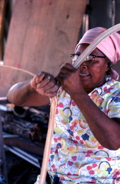 Lucreaty Clark peeling strips of white oak to make baskets