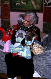 Laverne Cole holding dolls she made
