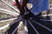 Lucreaty Clark starting to weave a white oak basket