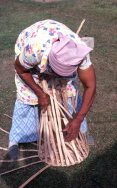 Lucreaty Clark weaving a white oak basket