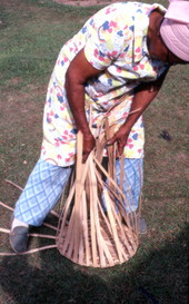 Lucreaty Clark weaving a white oak basket