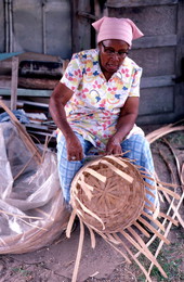 Lucreaty Clark weaving a white oak basket