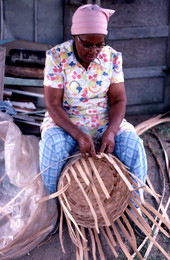 Lucreaty Clark weaving a white oak basket