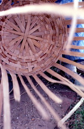 White oak basket being woven by Lucreaty Clark