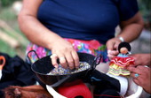 Mary Billie adding finishing touches to dolls - Big Cypress Seminole Indian Reservation