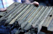Rolled cigars in a mold ready for the press at Ramar Cigars - Miami, Florida.
