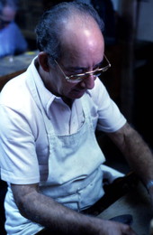 Cuban American man making cigars at Ramar Cigars in Little Havana - Miami, Florida.