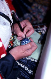 Woman decorating eggs - Tampa, Florida.