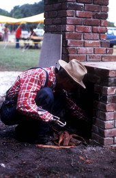 Placing firewood in the fireplace - Orlando, Florida.