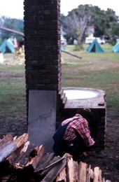Placing firewood in the fireplace - Orlando, Florida.