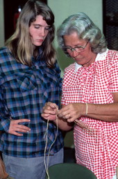 Mebelen Holloway demonstrating beginning techniques of pine needle basketry - Lake City, Florida.