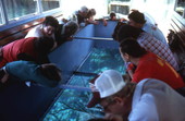 Tourists looking down through glass bottom - Wakulla Springs, Florida