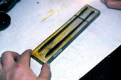 Melted rubber in a mold to make "Woody Worm" fishing lures- Inverness, Florida