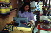 Lottie Huff sewing to make Seminole clothing for her store - Brighton Reservation, Florida