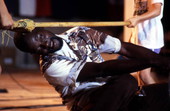 Member of the Junkanoos limbo dancing - White Springs, Florida
