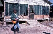 Buck Thompson playing blues guitar outside of his house - Hastings, Florida