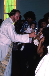 Chuck Bard performing a baptismal ceremony - Seville, Florida