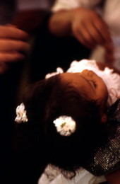 Child being baptised - Seville, Florida