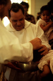 Chuck Bard and Miguel Alvarez performing a baptismal ceremony - Seville, Florida