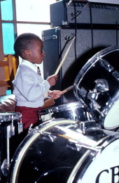 Boy playing drums at Pompey's Temple Church of God Through Christ - Hastings, Florida.