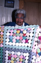 Ruth Rowe with a "yo-yo" coverlet she made - Pomona Park, Florida.