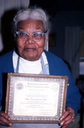 Ruth Rowe holding a 1956 award for participation in Home Decoration Clubs - Pomona Park, Florida.