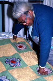 Ruth Rowe showing a quilt she made - Pomona Park, Florida.