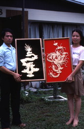 Tuan and Da Nguyen with Vietnamese crafts - Tampa, Florida.