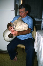 Nikitas Tsimouris playing a tsambouna for his family - Tarpon Springs, Florida