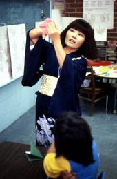 Yasuko Dawson making origami - Jacksonville, Florida.