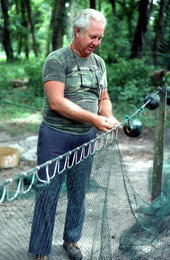 Net maker Martin Cooper repairing a shrimp trawl net - Jacksonville, Florida.