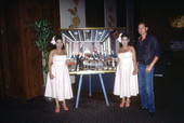 Cuban American artists Haydee and Sahara Scull posing with Mike Blandino and one of their paintings- Miami, Florida.