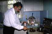 Father Elias, of St. Athanasius Church, making Greek coffee- Miami, Florida