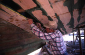 Bud Seymour takes measurements for new planks : Apalachicola, Florida.