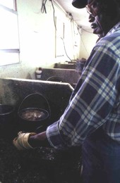 Oyster shucker at D.W. Wilson Seafood Co. - Apalachicola, Florida.