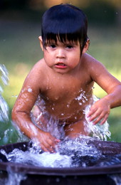 Addie Billie's greatgrandson splashing and playing in water - Ochopee, Florida